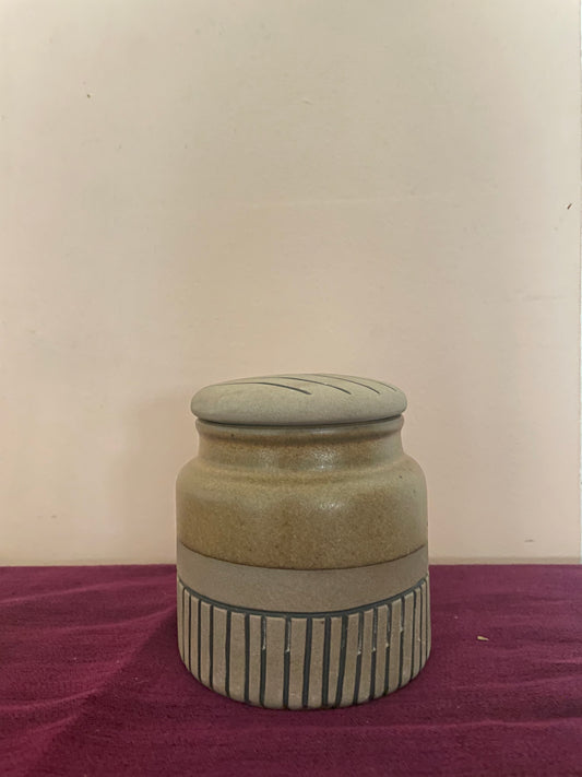 Medium ceramic jar with round lid, mustard glaze, bottom half in brown with black stripes. Buy tableware online in India.